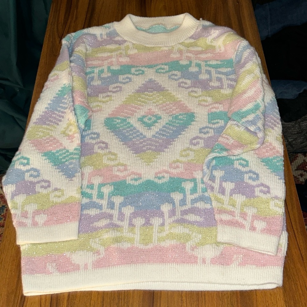 A pastel lovers dream 1980’s sweater with metallic sparkle thread!